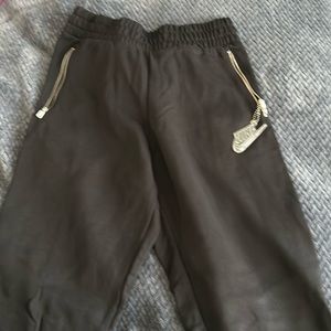 Nike women joggers.  Side zipper detail.